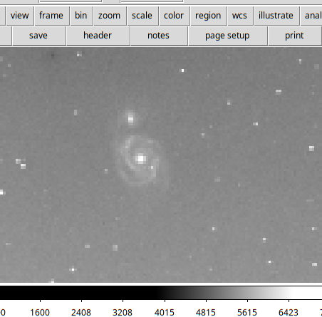 A screenshot with a clearly pixelated M51 in white on black; the spiral structure clearly shows.